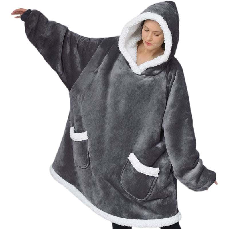Oversized sherpa hoodie blanket on the couch