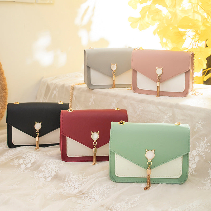 Small square crossbody bag with cat clasp