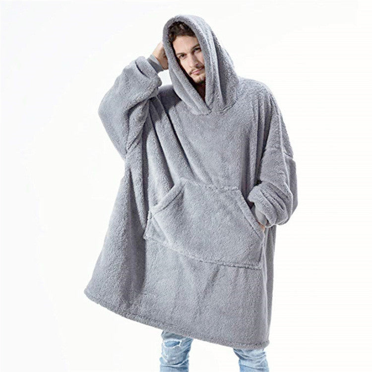 Person wearing oversized plush blanket hoodie