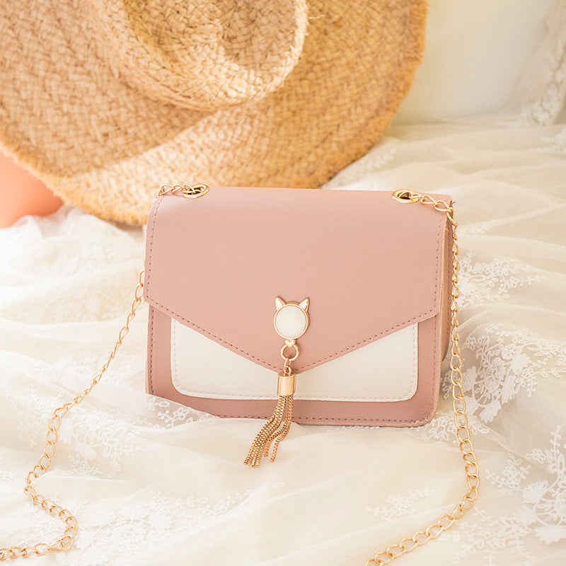 Small square crossbody bag with cat clasp